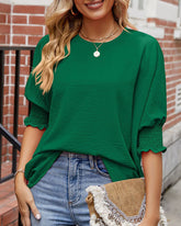 Enfärgad topp med rund hals och halvärm